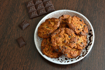 cookies americano with chocolate isolated on plate on kitchen table, close-up