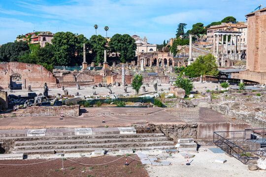 Italy Rome. Excavations in the center of Rome near the Colosseum.Well preserved buildings and artifacts on a sunny summer day against a blue sky.