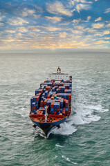 Nice aerial view of a giant container ship sailing at dawn in the English Channel