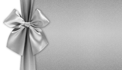 Silver bright ribbon bow isolated on glitter background, top view, copy space for gift greeting card, Merry Christmas and happy Easter or mother and father day banner or shopping advertising