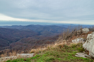 Stunning view of the mountain landscape. View from Mount Peus, a mountain peak in the Northwestern Caucasus. View from a height of 1000 m on the mountain peaks of the Black Sea coast of the Caucasus. 