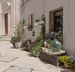 Puglia, Murge, white stone houses, alleys, basoli old town in a summer day.