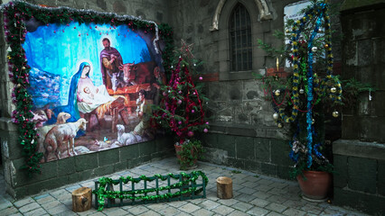 A banner heralding the birth of Christ in the garden of a church for christmas