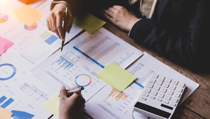 Technology and financial advisory services concert. Business teamwork and working on digital laptop computer with advisor showing plan of investment to clients at table office. Digital marketing.