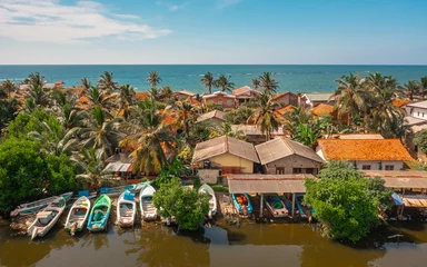 Foto op Aluminium Aerial view of houses on the shoreline in Negombo. Negombo is a city on the west coast of Sri Lanka © a_medvedkov