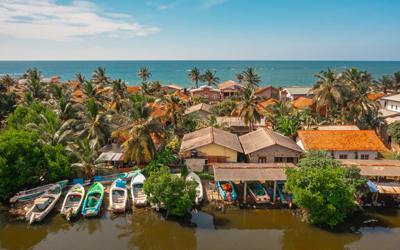 Aerial view of houses on the shoreline in Negombo. Negombo is a city on the west coast of Sri Lanka