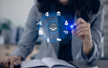 Concepts of Law and Legal services. Lawyer working with law interface icons. Blurred background.	