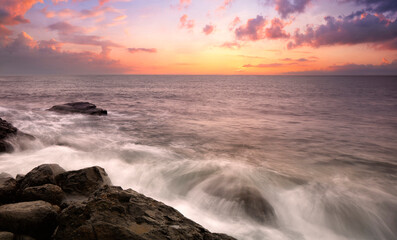 Plakat Sunset at Sea, stones on the shore, Amazing perfect pink dreamy looking sunset. Smooth water