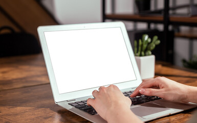 Laptop screen mockup, hands typing on computer keyboard, PC with white blank empty display monitor on office desk. High quality photo