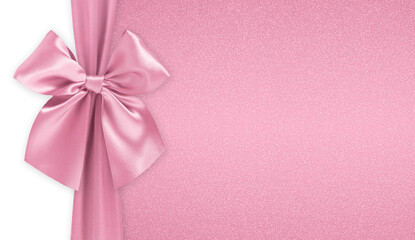 Pink  bright ribbon bow isolated on glitter background, top view, copy space for gift greeting...