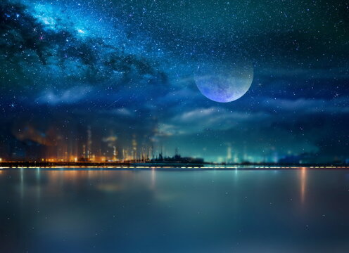  night sea  starry sky  in harbor ,blue sea water  nebula and big moon on sea on horizon city light blurred light