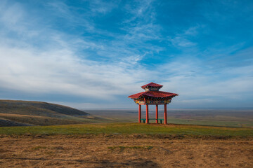 Naklejka premium Beautiful Buddhist gate in the endless steppe