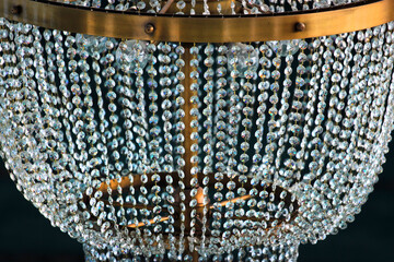 Chandelier in a mosque, many glass beads reflecting and refracting light