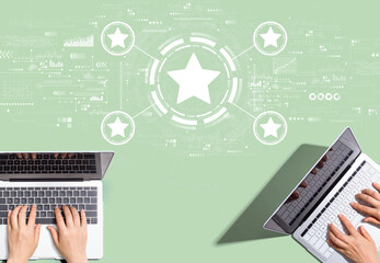 Rating star concept with people working together with laptop computers