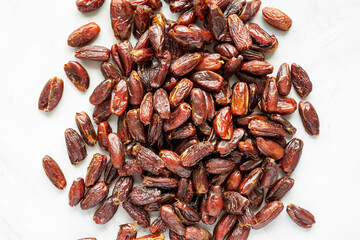 Pitted Organic Dates on gray background, top view. Flat lay, overhead, from above.