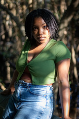 Natural Black woman enjoying her walk in a nature park