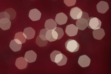 Blurred white lights on dark red background