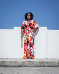 Natural Black Woman basking in the sun enjoying the water.