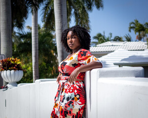 Natural Black Woman basking in the sun enjoying the water.