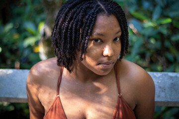 Natural Black woman enjoying her walk in a nature park