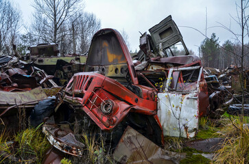 Abandoned and destroyed old soviet trucks in old scrapyard. Heavy industrial scrap metal for...
