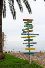 A playful beach sign with signs in Montenegro
