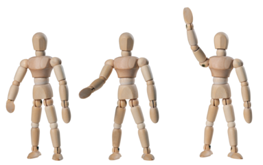 Wooden man in three positions. Isolated background.