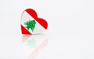 Flag of Lebanon in the shape of a heart on a white background. The concept of patriotism. copyspace..