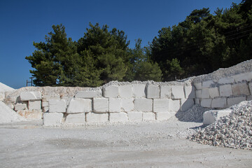 White marble stone in blocks, just excavated from mine with heavy machinery, ready for further processing in to final product. Each stone block is 5 tons heavy 
