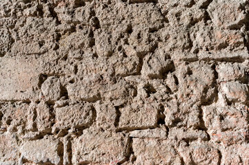 Close up of stonewall with red brick texture