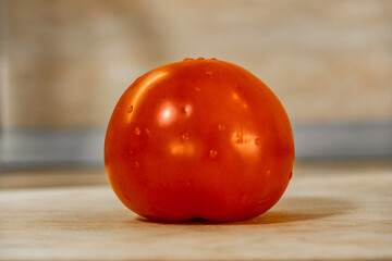 washed ripe tomato on the table