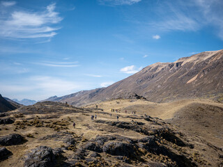 tourists walking towards the glacier on a mountain, in peru south america