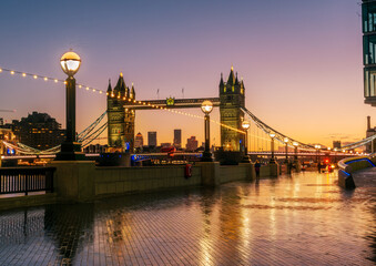 View from More London Place of the famous Tower Bridge illuminated at sunset, in Christmas holiday period