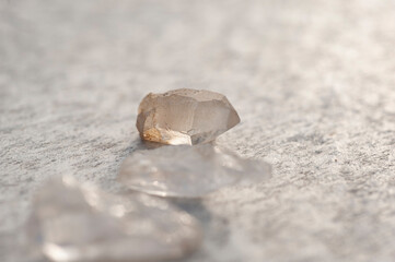 Raw Quartz crystal photographed on stone. 