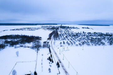 Top view of the winter panorama of the Vileysky reservoir and the village
