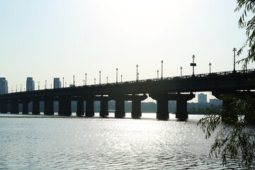 Fototapeta na wymiar Beautiful view of beam bridge over river on sunny day