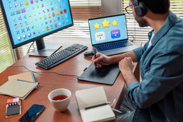 Focused man designer in headphones works in home office. High quality photo