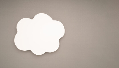 A blank white cloud speech bubble on a gray background