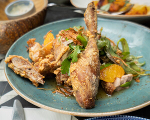 Fried duck drumstick dish in an Asian restaurant, Auckland.