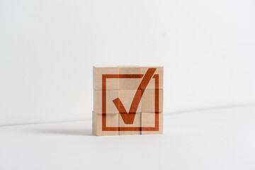 checkbox on the wooden cubes as the symbol of agreement
