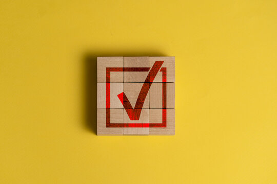 checkbox on the wooden cubes as the symbol of agreement