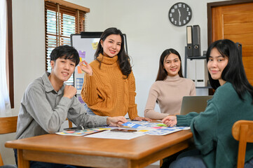 Team of Asian mobile application developers and designers are in the meeting. UX UI team concept