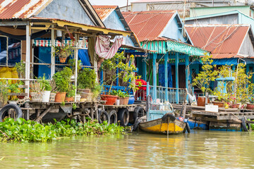 Colourful floating river houses with verandas at Chau Doc in Vietnam