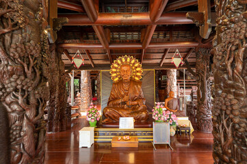 Fototapeta premium Bangkok, Thailand, August 21, 2022 : Wat Sangkathan. Wooden Seated Somdej Phra Buddhacarya (Toh Brahmaramsi) Buddha image.