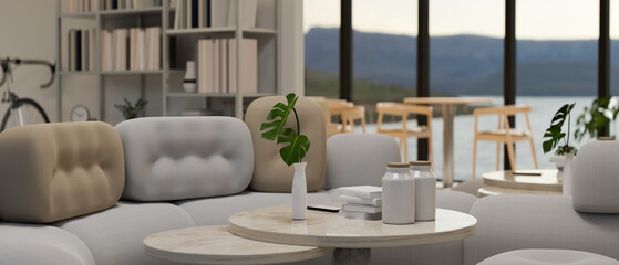 Modern contemporary living room with stylish couch, coffee table with decor, shelves and decor