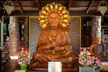 Fototapeta na wymiar Bangkok, Thailand, August 21, 2022 : Wat Sangkathan. Wooden Seated Somdej Phra Buddhacarya (Toh Brahmaramsi) Buddha image.