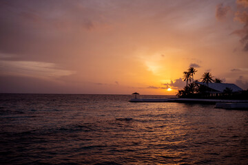 Naklejka na ściany i meble Photos of the beautiful sunset at the sea resort.