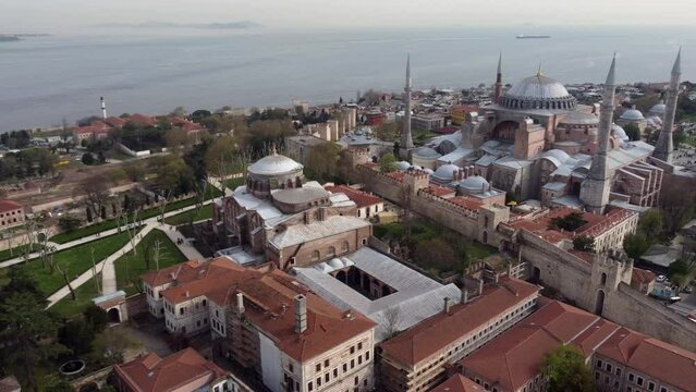 Drone shot of Hagia Irene and Hagia Sophia in Istanbul, Turkey - drone is circling around. Snippet could ideally be used for travel or Istanbul related movies and Europe, Asia or Turkey videos.