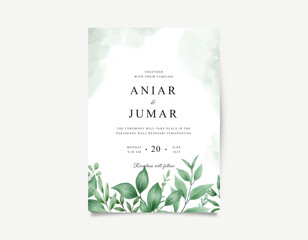 Wedding invitation card with green watercolor leaves