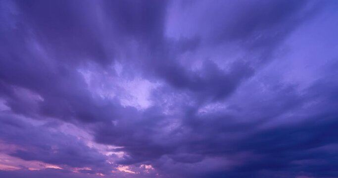 Beautiful Time lapse of Majestic sunset sky over sea landscape, Amazing light of nature cloudscape sky and dark clouds moving away rolling,Dark sunset cloud amazing background